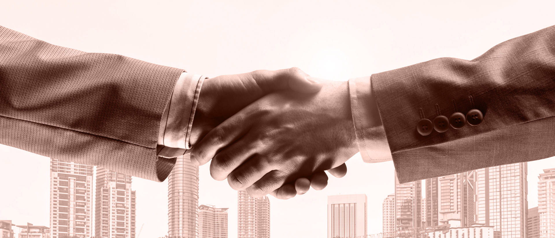 Handshake vor Business-Hintergrund Handshake vor Business-Hintergrund